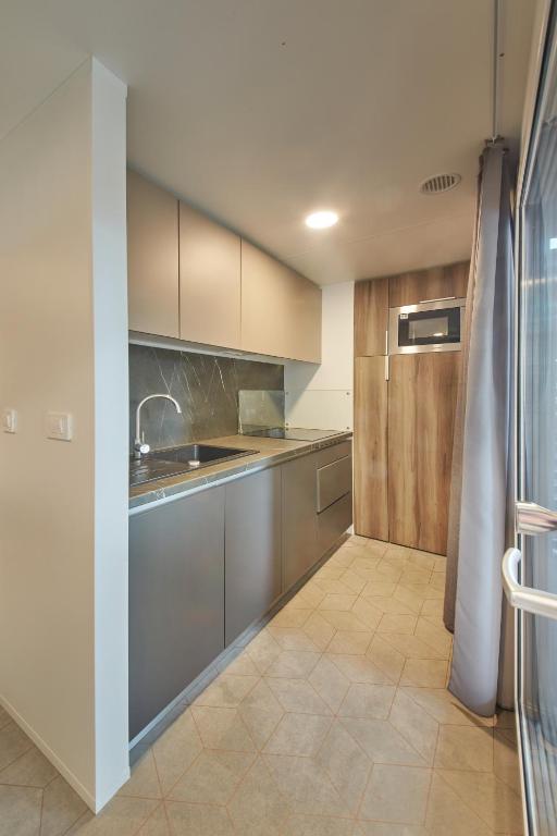 Kuchyň nebo kuchyňský kout v ubytování Premium Mobile Homes - Hotel & Resort Adria Ankaran