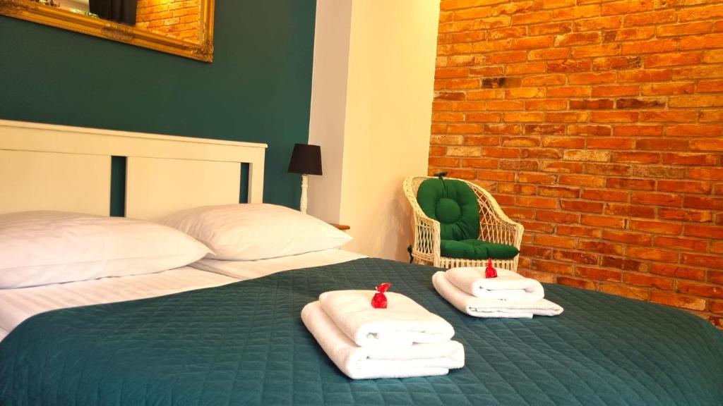 Posteľ alebo postele v izbe v ubytovaní H&T Old Town Szeroka 36