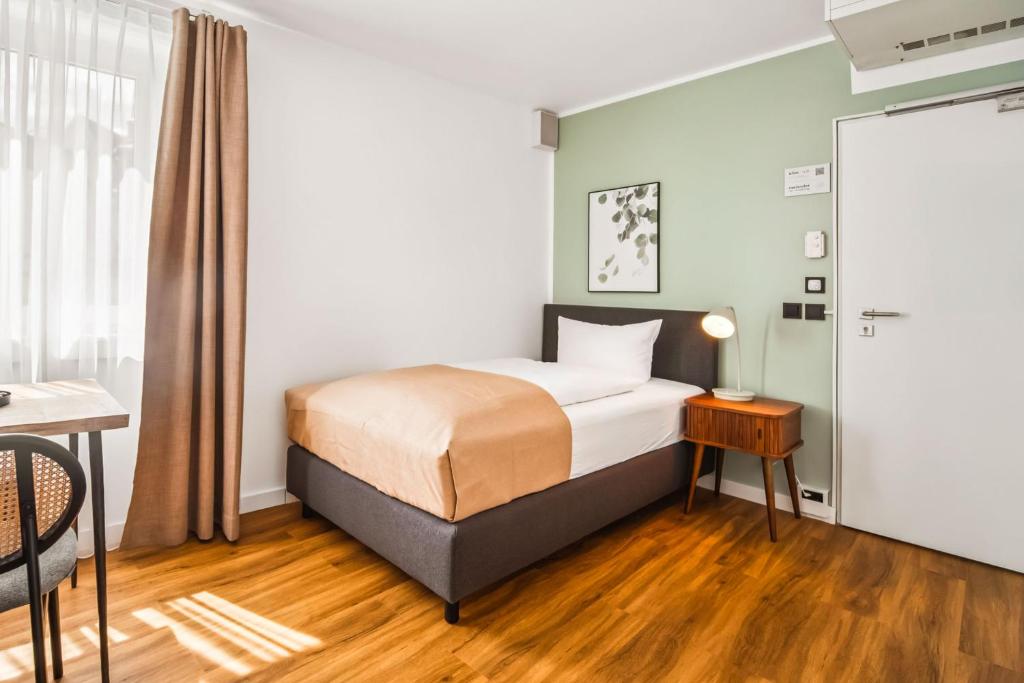Postel nebo postele na pokoji v ubytování limehome Jena Teichgraben