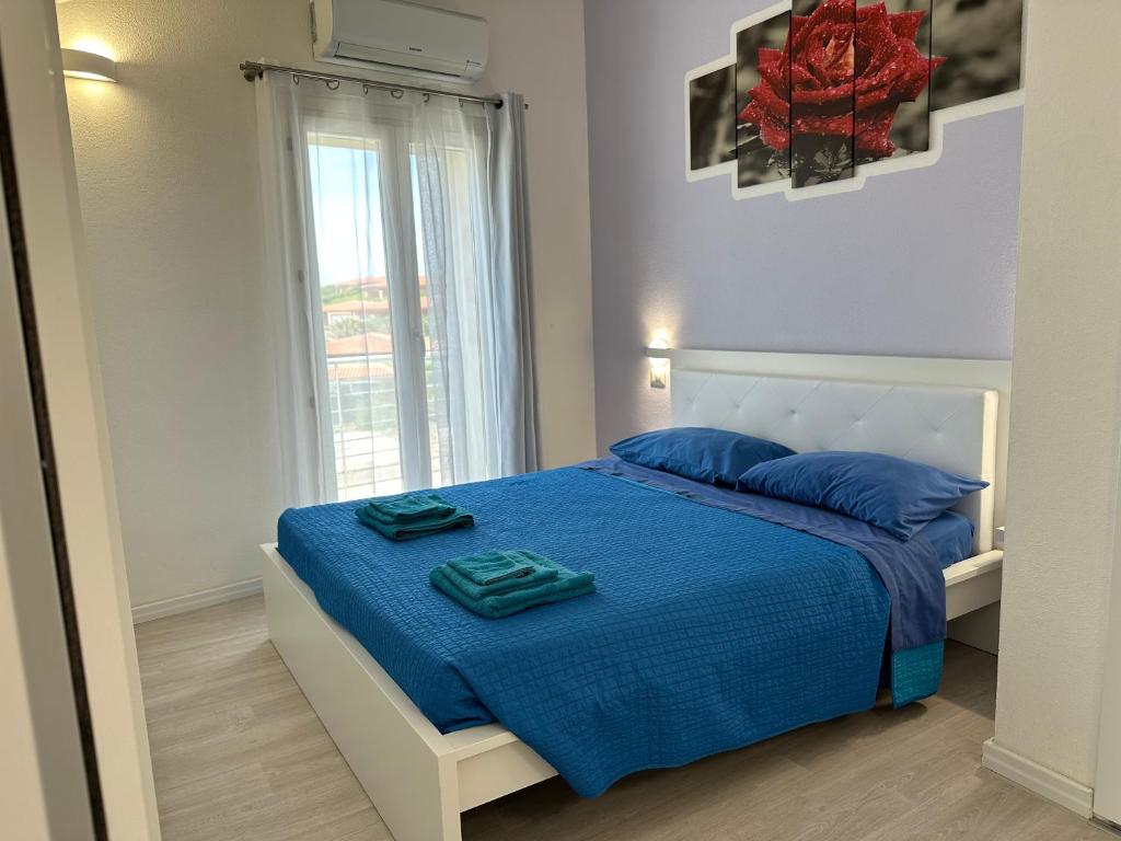 Postel nebo postele na pokoji v ubytování Alloggio Ulivi
