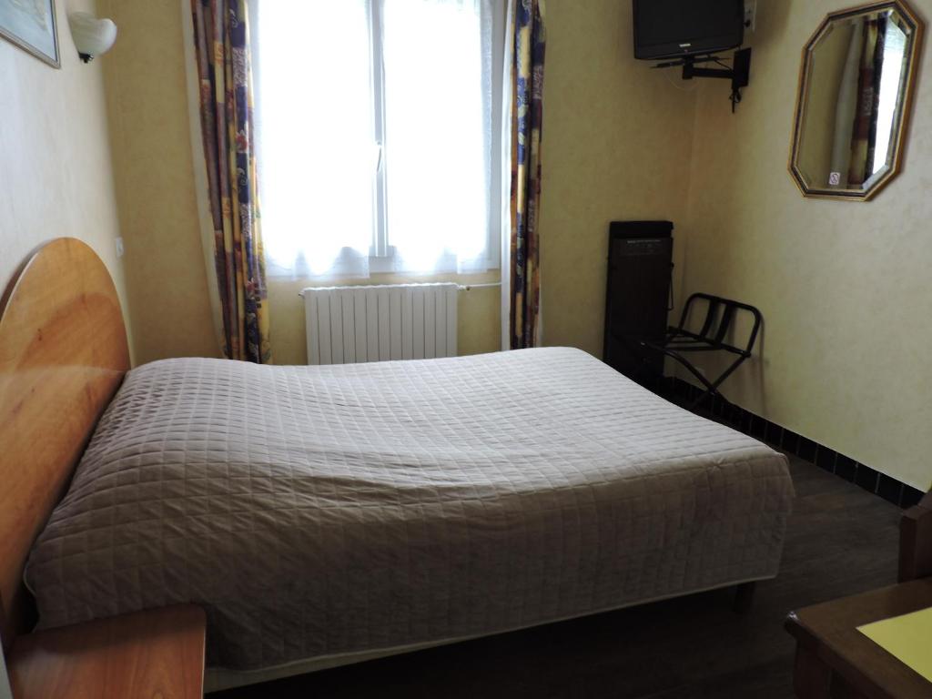 Postel nebo postele na pokoji v ubytování Belvedere Montargis Amilly