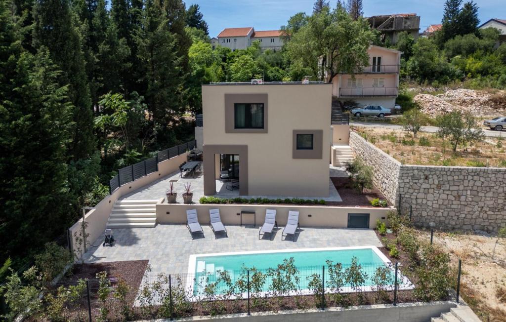 an aerial view of a house with a swimming pool at Villa D Cube by Villas Guide in Kremena