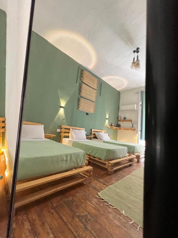 Postel nebo postele na pokoji v ubytování Rhala Hostel Egypt