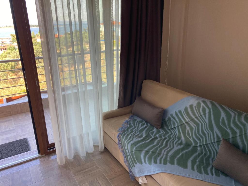 Postel nebo postele na pokoji v ubytování Thealos Rooms