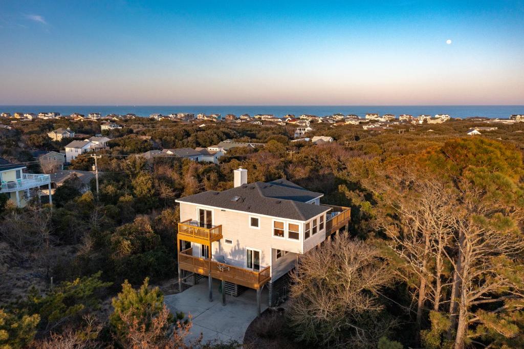 an aerial view of a house with the ocean in the background at SH153 Southern Shores 153 in Duck