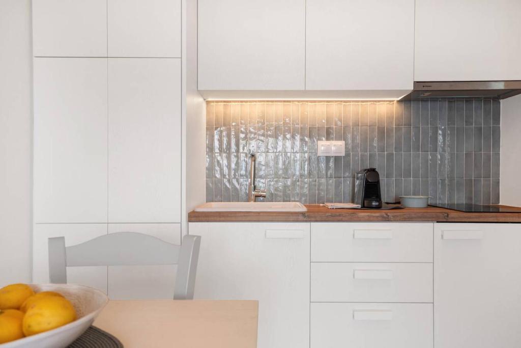 A kitchen or kitchenette at Myrto Homes Lefkada Agios Nikitas Greece
