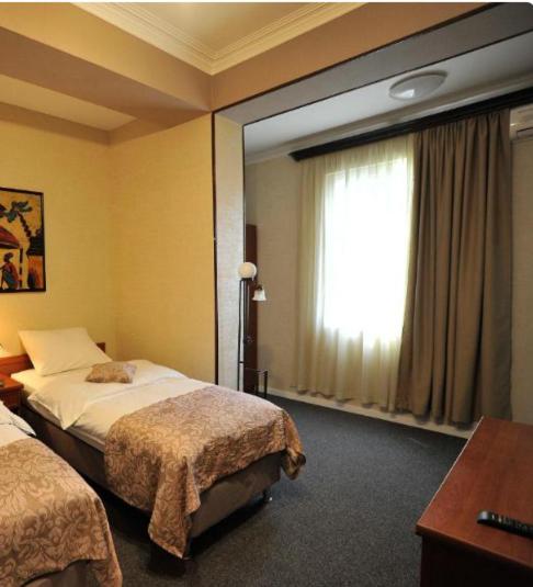 Postel nebo postele na pokoji v ubytování ZP Hotel