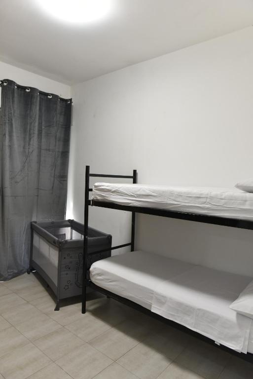 Postel nebo postele na pokoji v ubytování Carini Sant Anna