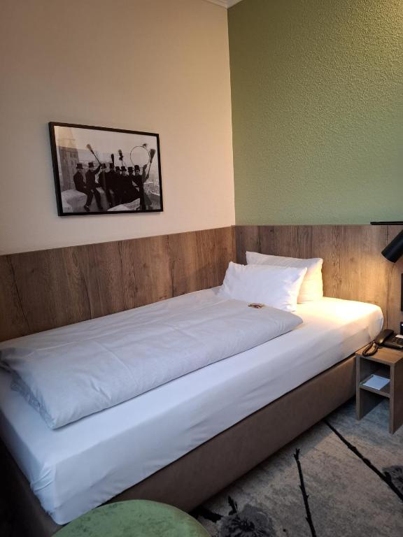 Postel nebo postele na pokoji v ubytování LIHO - einfach Lübeck