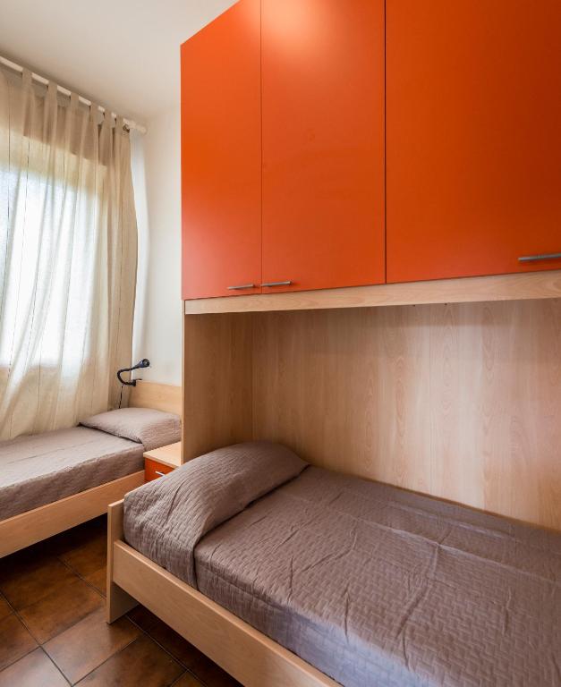 Posteľ alebo postele v izbe v ubytovaní Caletta Apartments