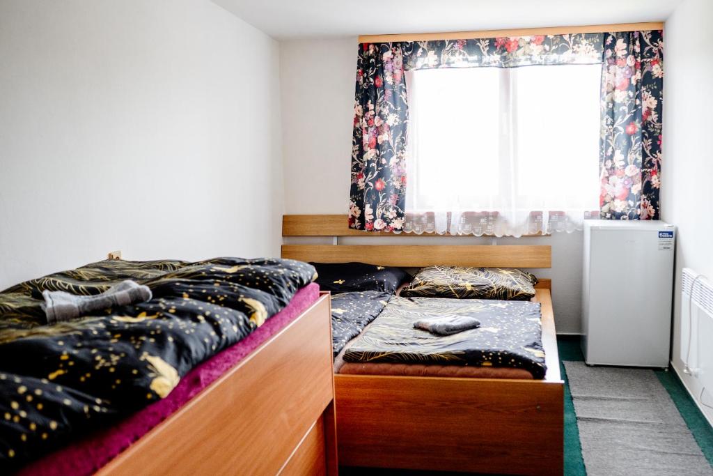 Postel nebo postele na pokoji v ubytování Ubytování Česká Skalice