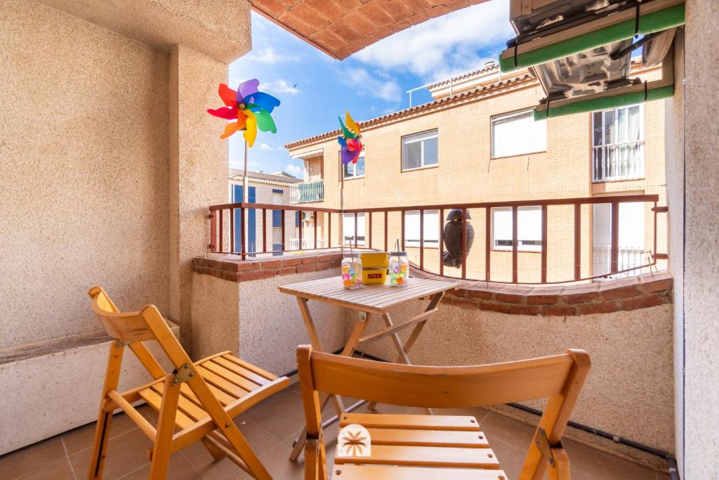 a balcony with a table and two chairs on a balcony at Mediterranean Way - Anguera in Cambrils