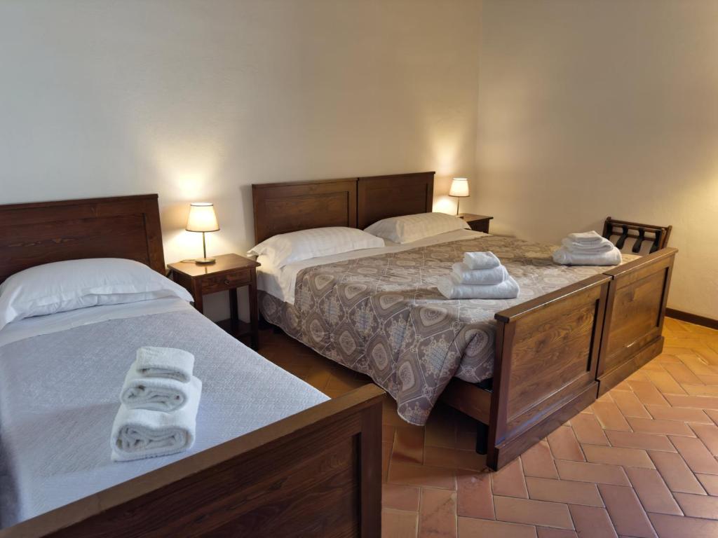 Postel nebo postele na pokoji v ubytování Abbazia dei Santi Felice e Mauro