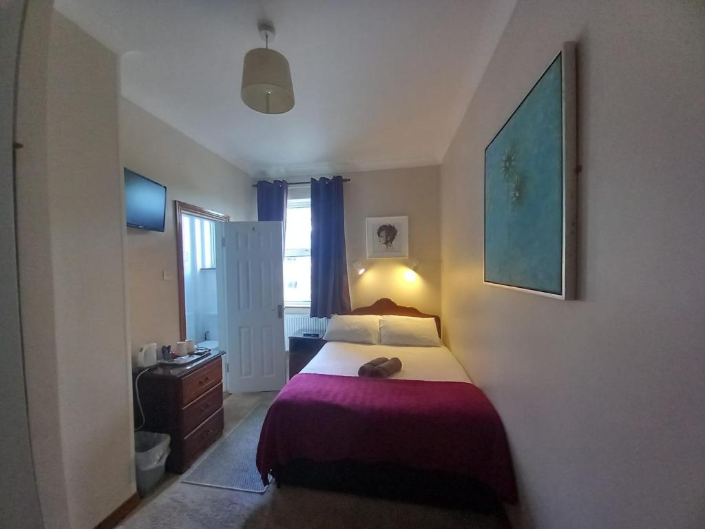 Postel nebo postele na pokoji v ubytování Bay View Guesthouse