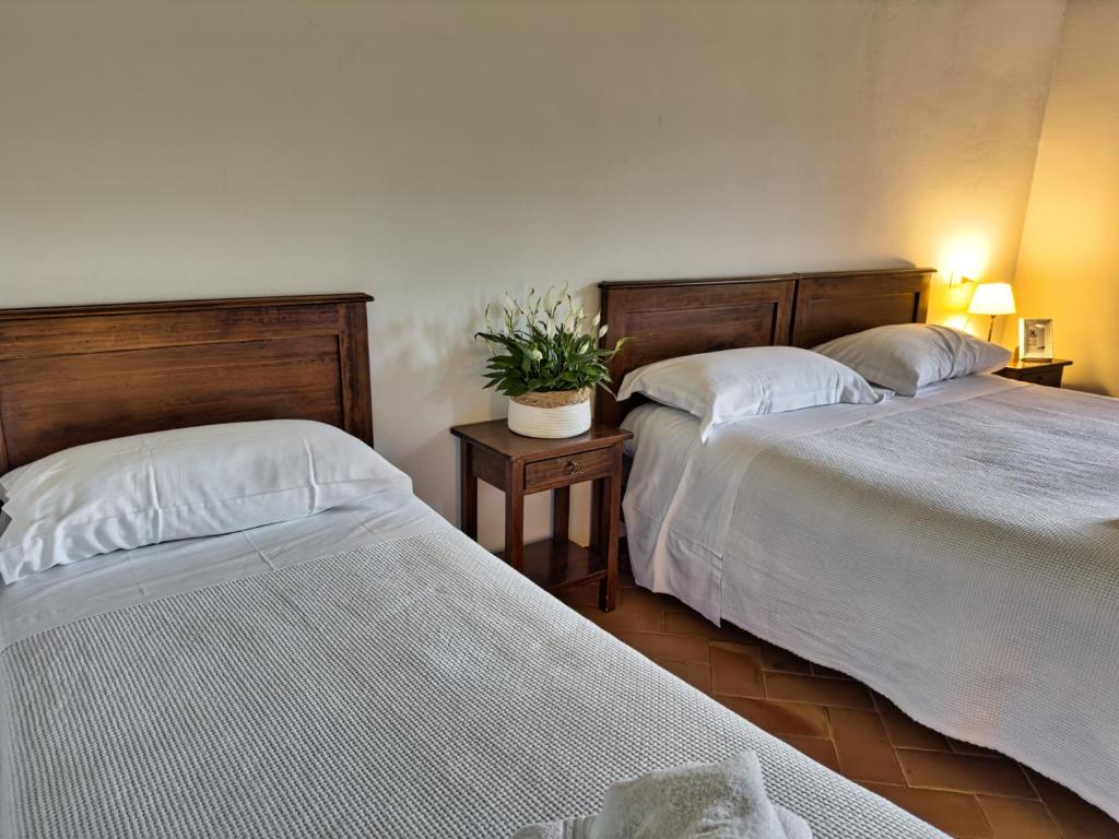 Postel nebo postele na pokoji v ubytování Abbazia dei Santi Felice e Mauro