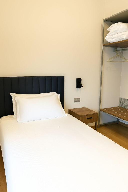 Postel nebo postele na pokoji v ubytování Urban Hotel