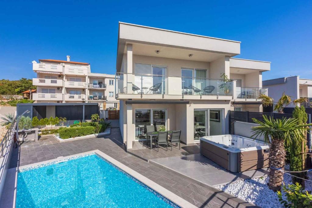 an image of a house with a swimming pool at Holiday home in Crikvenica 45063 in Crikvenica
