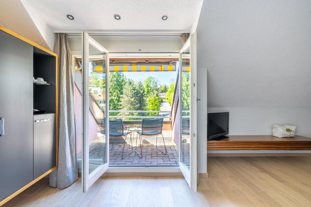 TV a/nebo společenská místnost v ubytování Seehotel Kastanienbaum