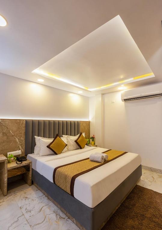 Postel nebo postele na pokoji v ubytování Hotel All In Homes - New Delhi Railway station- Paharganj