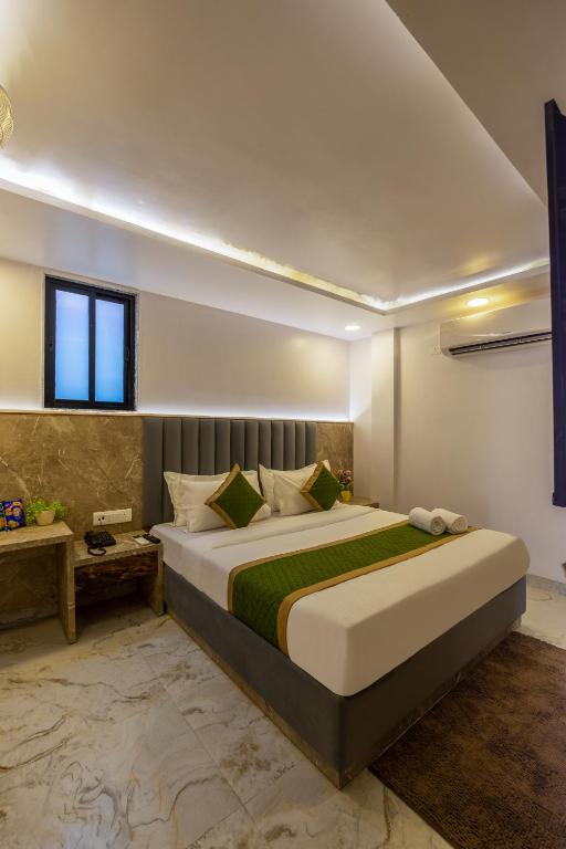 Postel nebo postele na pokoji v ubytování Hotel All In Homes - New Delhi Railway station- Paharganj