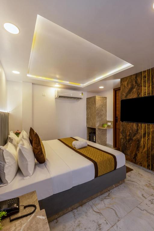 Postel nebo postele na pokoji v ubytování Hotel All In Homes - New Delhi Railway station- Paharganj