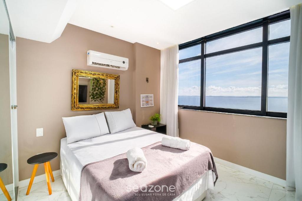 Ένα ή περισσότερα κρεβάτια σε δωμάτιο στο Apto Vista Mar na Vitória-SSA - SVM1409