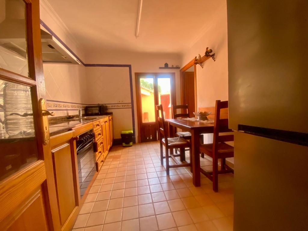 A kitchen or kitchenette at Rural Charm villa and Outdoor Adventure Agritourism Apartment with Private Mountain Path approximately 5 minutes walking from the beach Ideal for relaxation
