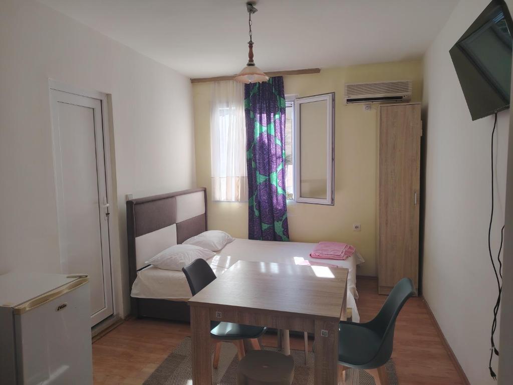 TV a/nebo společenská místnost v ubytování Studio apartmani Dream Iv