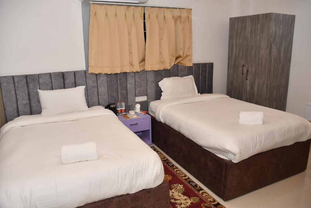 Postel nebo postele na pokoji v ubytování Hotel Ratneswar
