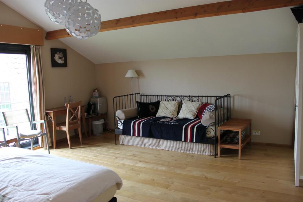 Postel nebo postele na pokoji v ubytování B&B Lomolen