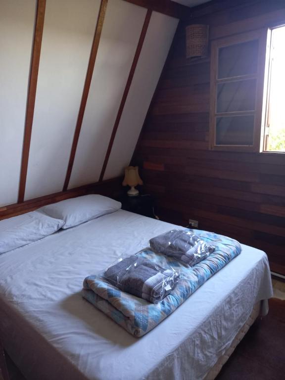Postel nebo postele na pokoji v ubytování Chalé Rancho Ouro Verde RO
