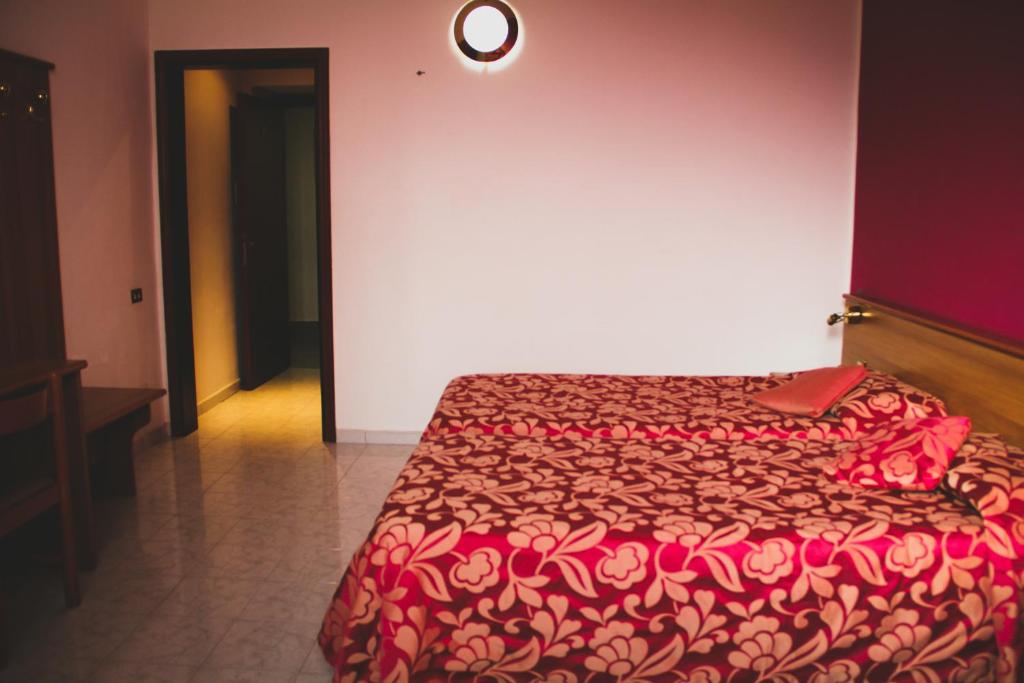 Postel nebo postele na pokoji v ubytování Hotel Santa Marta