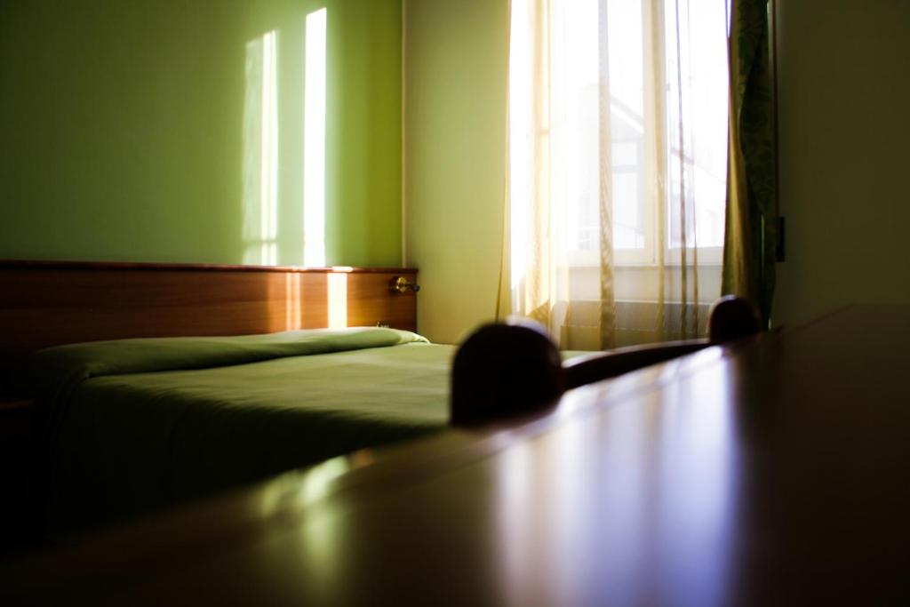 Postel nebo postele na pokoji v ubytování Hotel Santa Marta