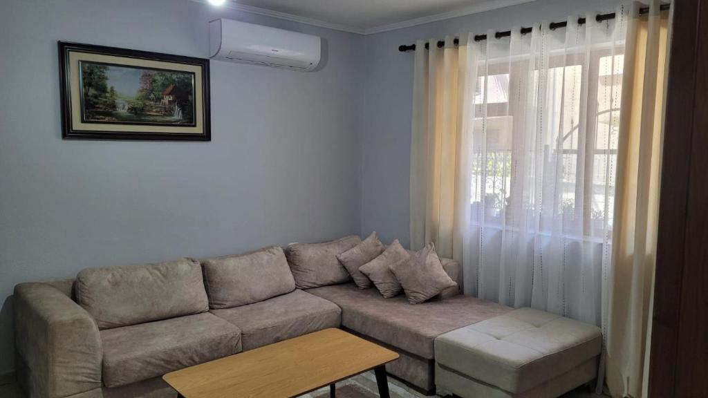 a living room with a couch and a table at Brayan guest house in Pogradec
