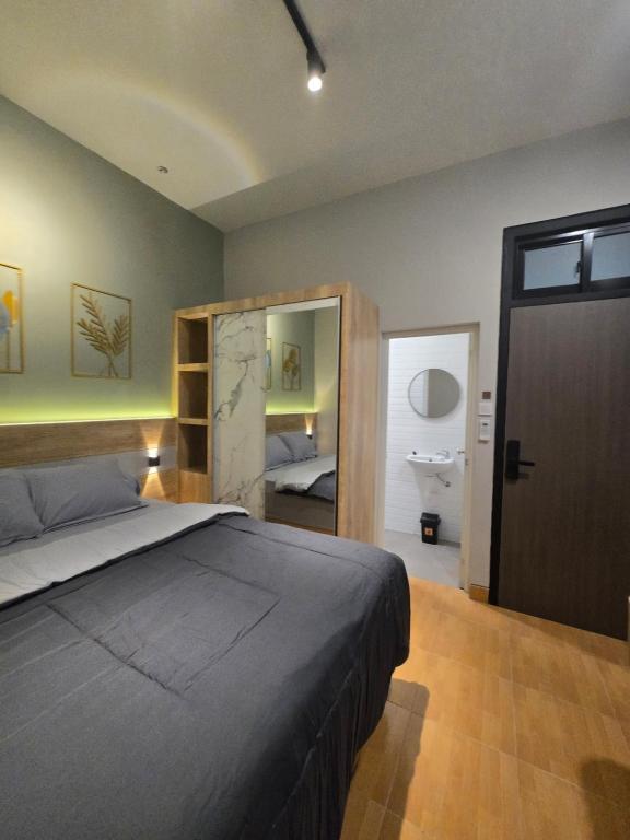 Postel nebo postele na pokoji v ubytování Rebahan Stay