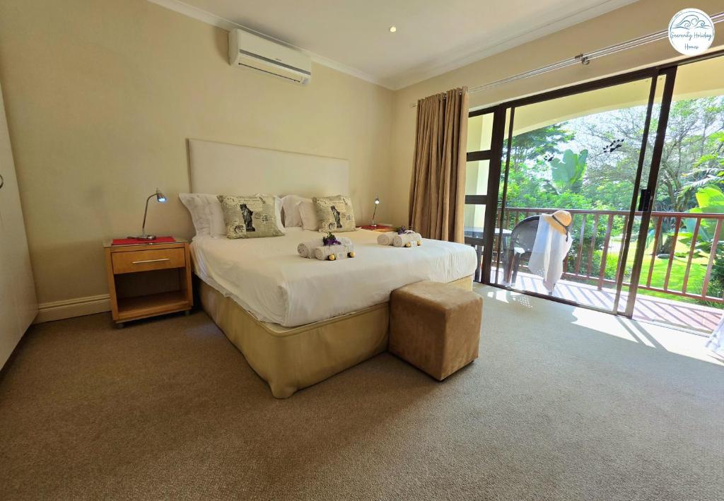 a bedroom with a bed with two teddy bears on it at Villa T7 - Selborne Golf Estate in Pennington