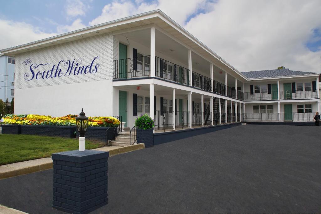 a large white building with a large parking lot at The Southwinds in Cape May