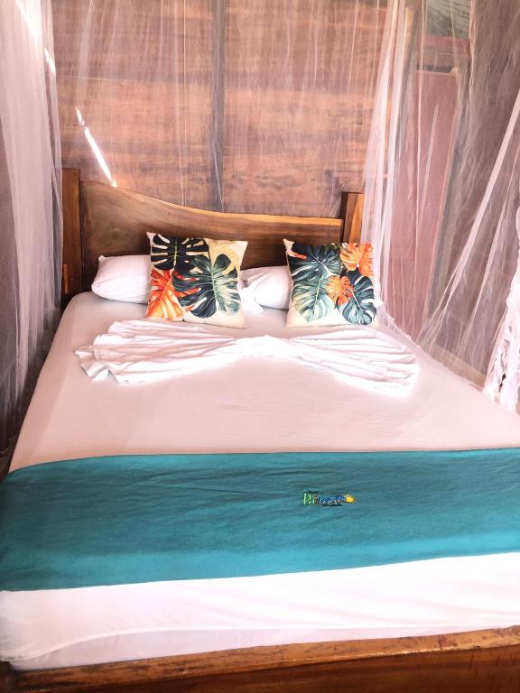 Postel nebo postele na pokoji v ubytování Palmarío Hostal