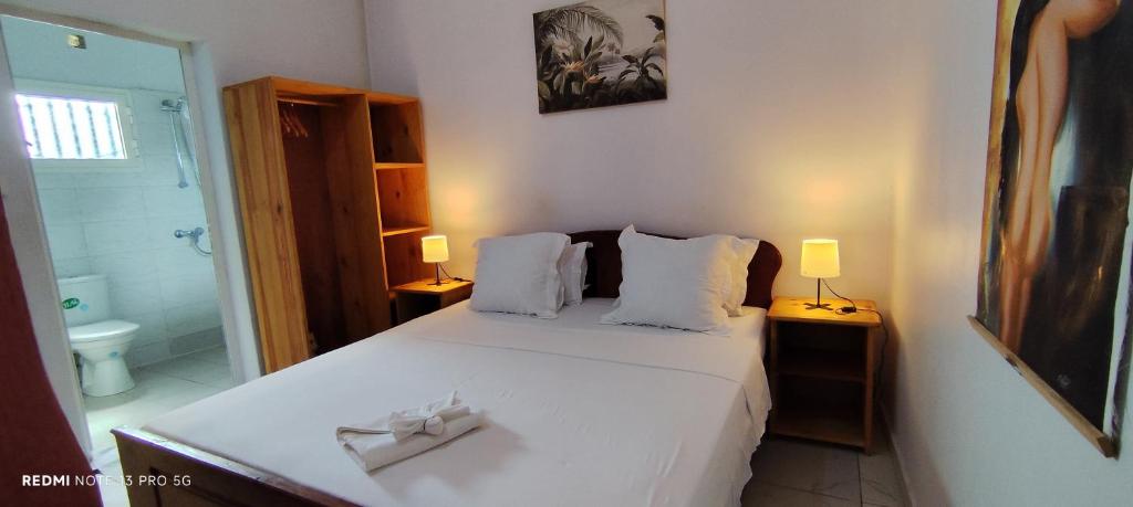 Postel nebo postele na pokoji v ubytování AUBERGE de L'HIPPOCAMPE