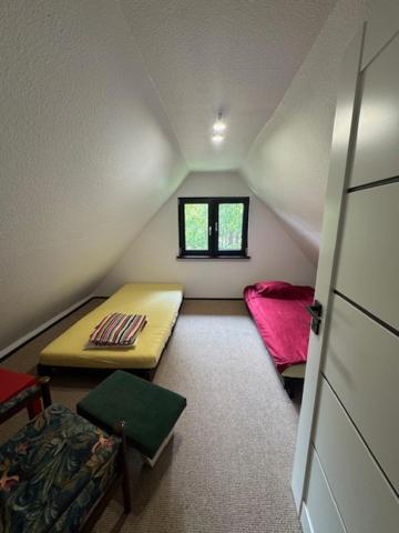 Posteľ alebo postele v izbe v ubytovaní Domek na górce