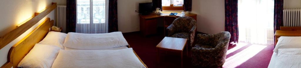 Postel nebo postele na pokoji v ubytování Hotel Victoria