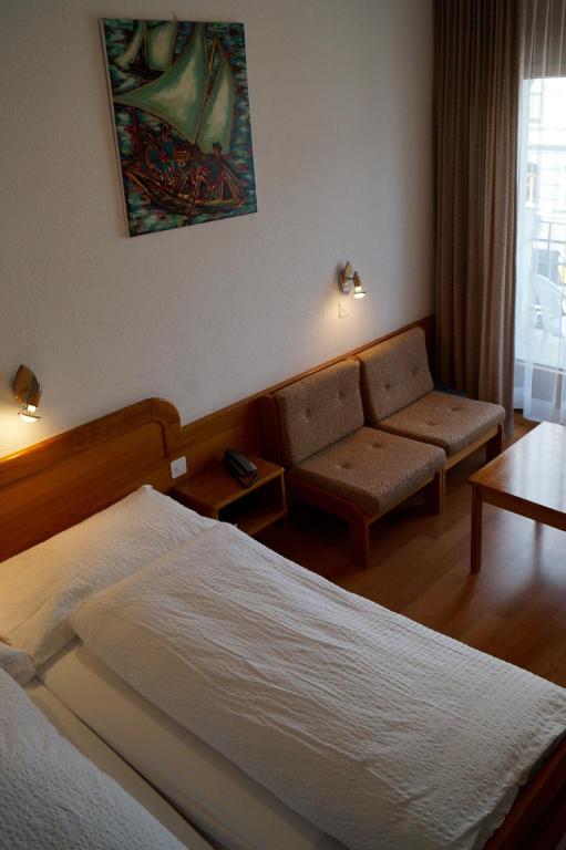 Postel nebo postele na pokoji v ubytování Hotel Victoria