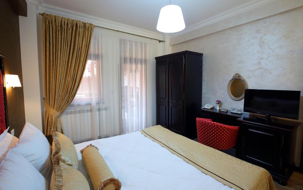 Postel nebo postele na pokoji v ubytování Hotel Galany