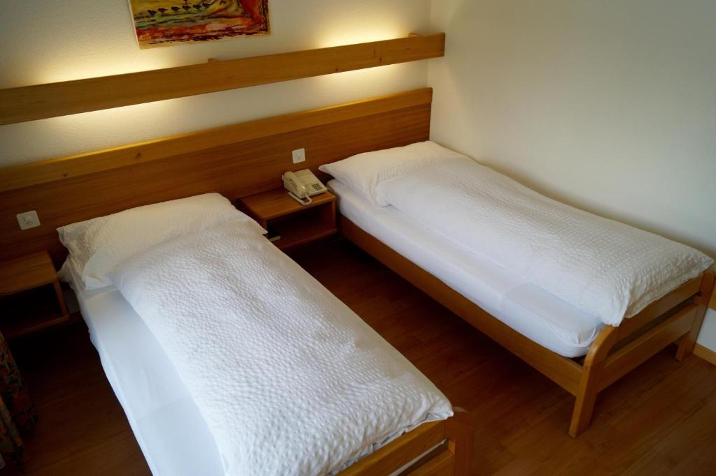 Postel nebo postele na pokoji v ubytování Hotel Victoria