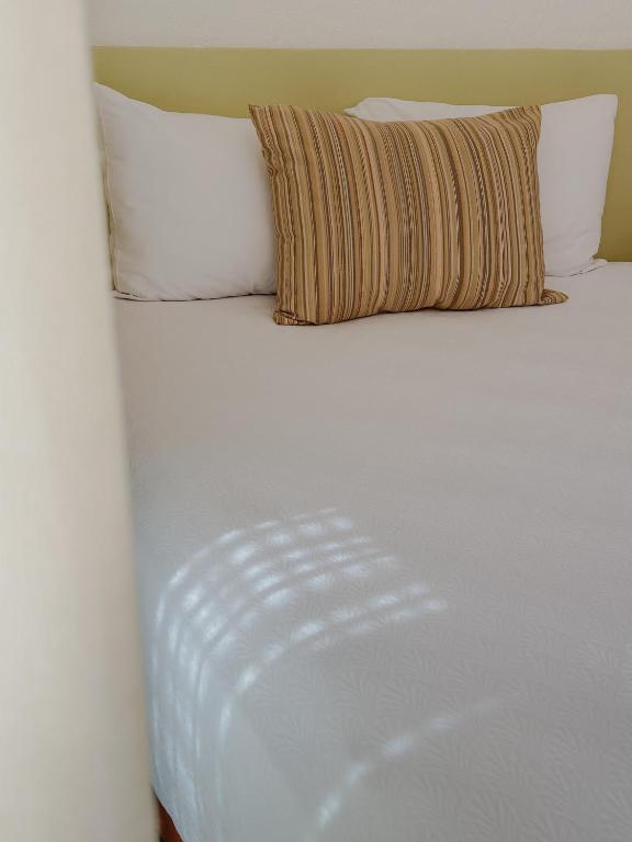 Postel nebo postele na pokoji v ubytování Hotel Los Patios