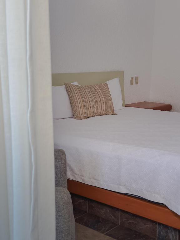Postel nebo postele na pokoji v ubytování Hotel Los Patios