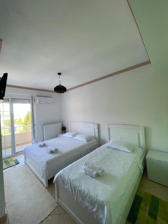 Postel nebo postele na pokoji v ubytování HOTEL VILA TOSKA