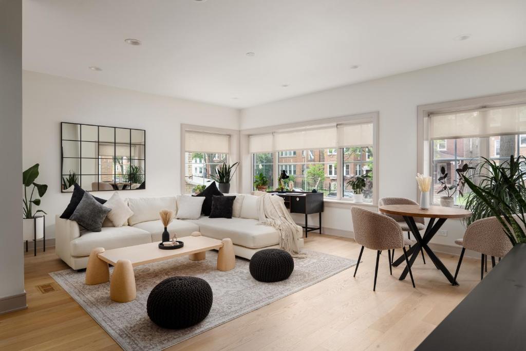 a living room with a white couch and a table at Ace Properties in Chicago