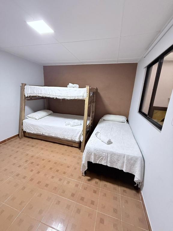 Postel nebo postele na pokoji v ubytování Casa hotel la 33