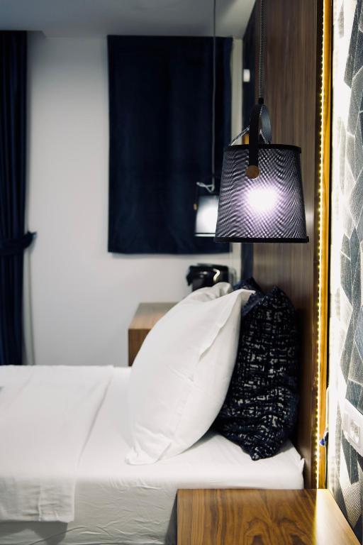 Postel nebo postele na pokoji v ubytování Hvar Riva Rooms